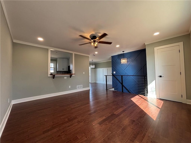 empty room with recessed lighting, crown molding, baseboards, and dark wood-style flooring