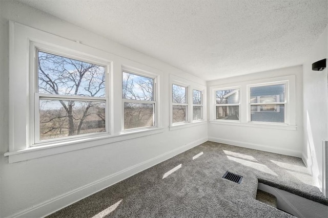 unfurnished sunroom with visible vents