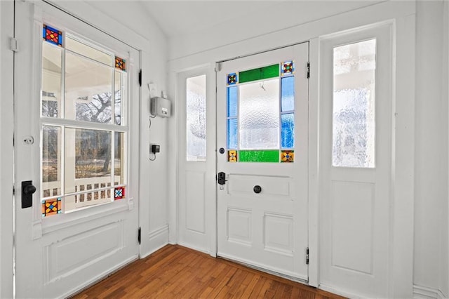 foyer with a healthy amount of sunlight and hardwood / wood-style floors