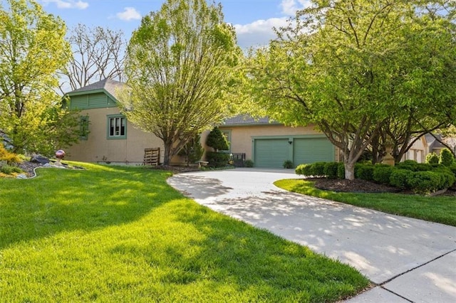 view of front of house with an attached garage, a front lawn, stucco siding, and concrete driveway
