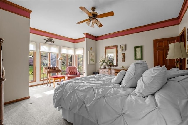 bedroom featuring baseboards, ornamental molding, ceiling fan, and light colored carpet