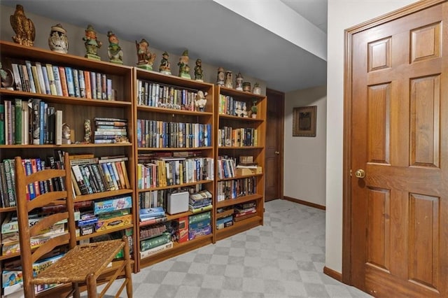 interior space featuring baseboards and tile patterned floors