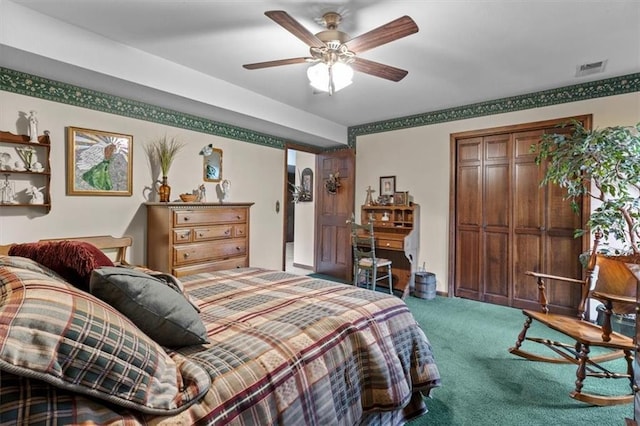 carpeted bedroom featuring ceiling fan, visible vents, and a closet
