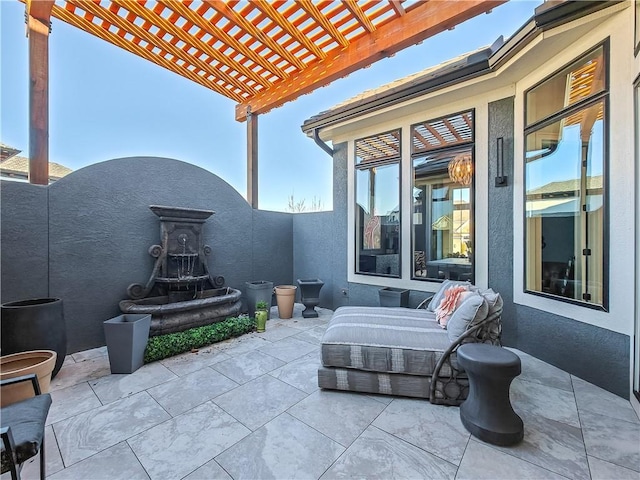 view of patio / terrace with fence and a pergola