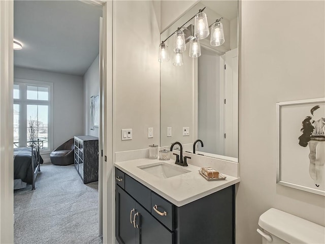 bathroom featuring vanity and toilet