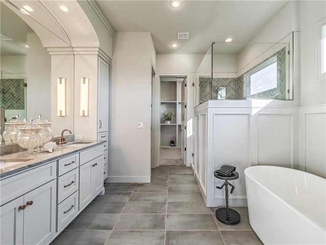 full bath with visible vents, a soaking tub, a sink, a shower stall, and tile patterned floors