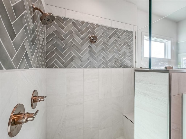 full bath with tiled shower