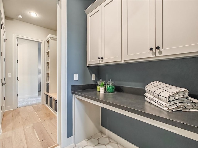 interior space featuring light wood-style floors and baseboards