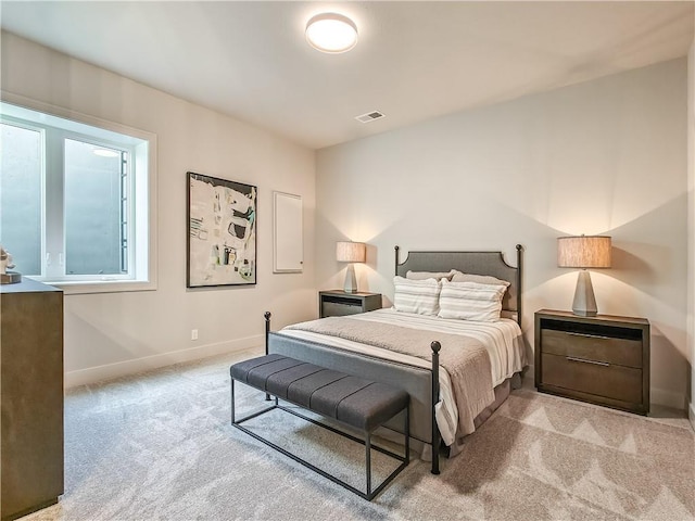 bedroom featuring visible vents, carpet floors, and baseboards