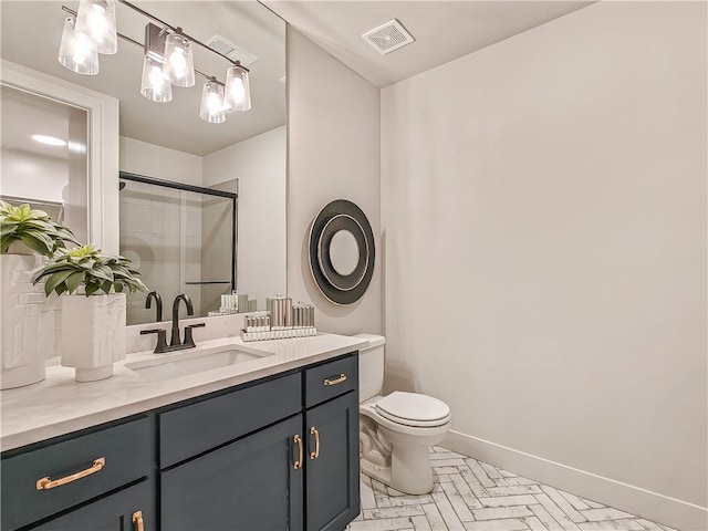 bathroom featuring vanity, baseboards, visible vents, a shower stall, and toilet