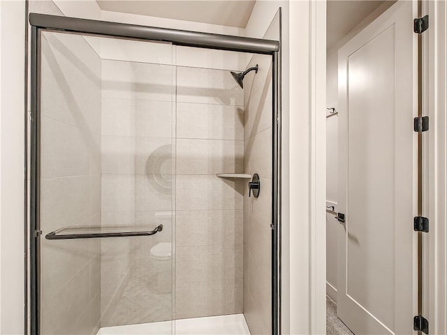 full bath with a shower stall