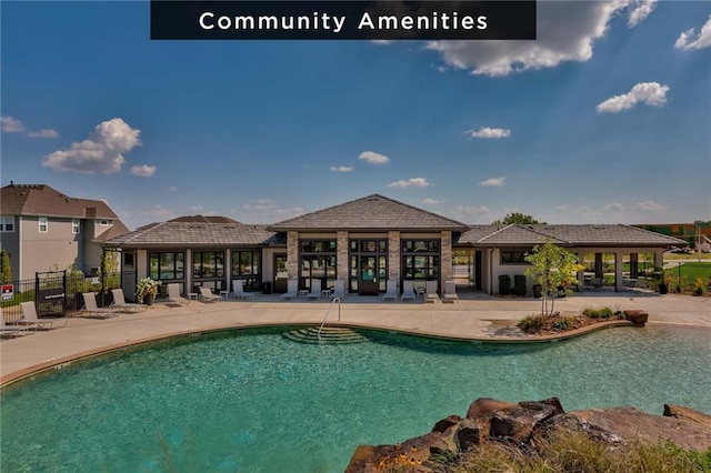 pool with a gazebo, a patio, and fence