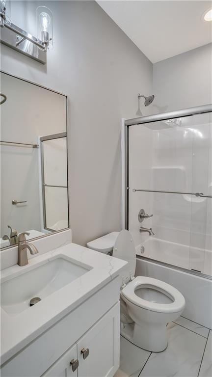 bathroom with  shower combination, toilet, vanity, and marble finish flooring