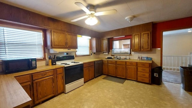 kitchen featuring black microwave, under cabinet range hood, dishwasher, light countertops, and white range with electric stovetop