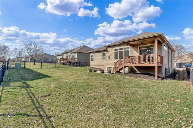 back of house with a ceiling fan, stairway, a yard, and a fenced backyard