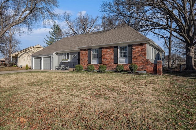 ranch-style house featuring a front yard, brick siding, a garage, and roof with shingles