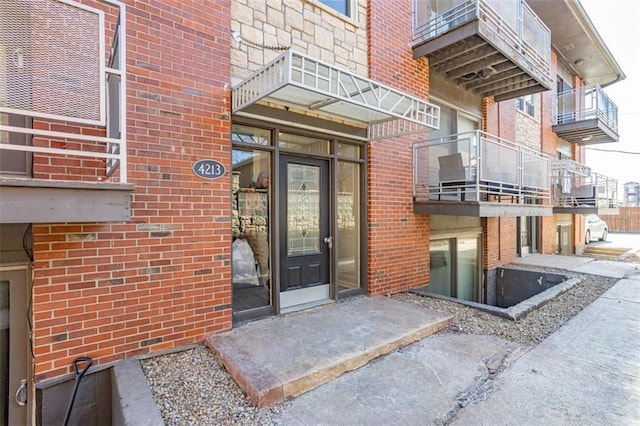 entrance to property with brick siding