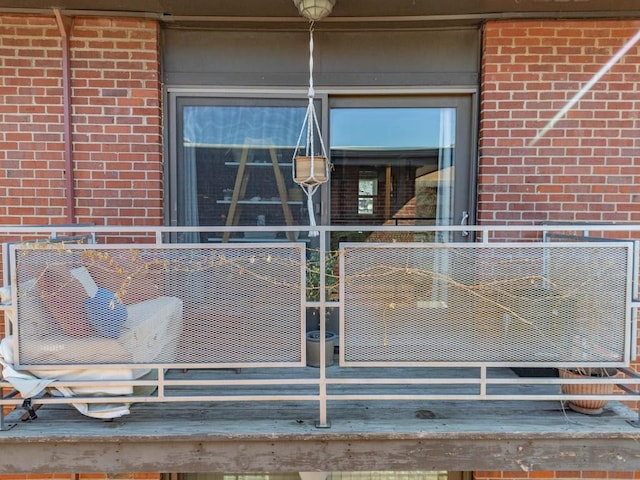 property entrance with brick siding