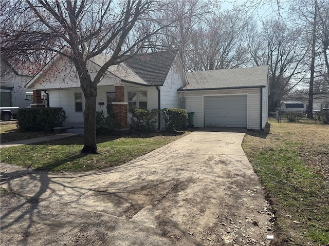 view of front of home featuring a garage, roof with shingles, and concrete driveway