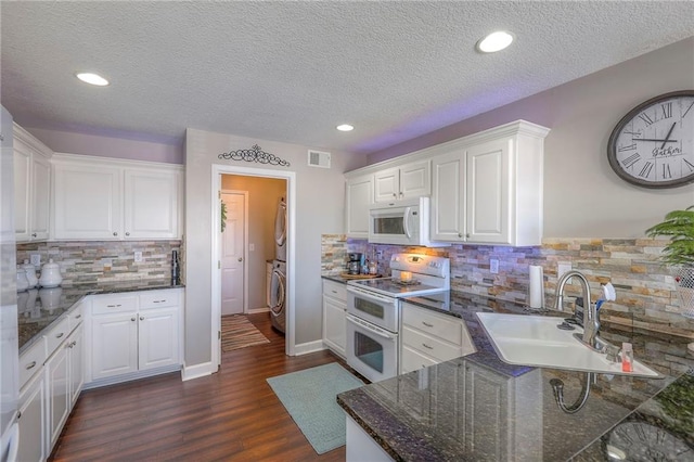 21212 E 52nd Street Ct, Blue Springs, MO 64015 - kitchen with decorative backsplash, white appliances, and a sink