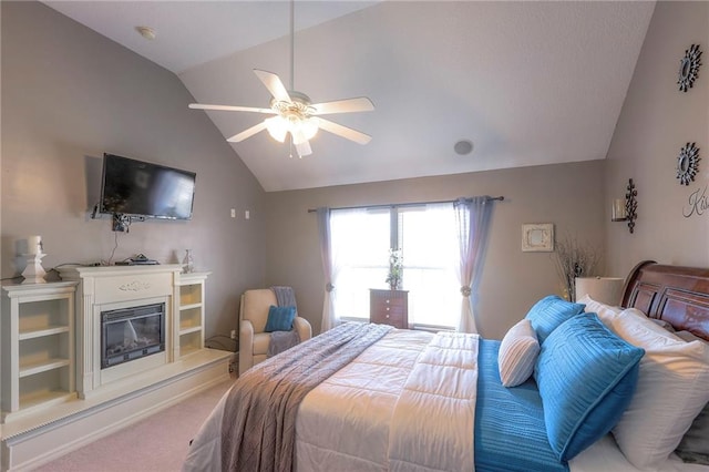 21212 E 52nd Street Ct, Blue Springs, MO 64015 - carpeted bedroom with vaulted ceiling, a glass covered fireplace, and a ceiling fan