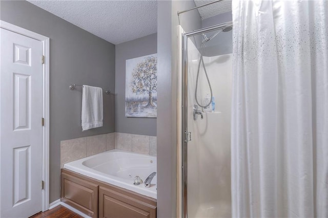 21212 E 52nd Street Ct, Blue Springs, MO 64015 - full bathroom with a bath, a textured ceiling, and a shower stall