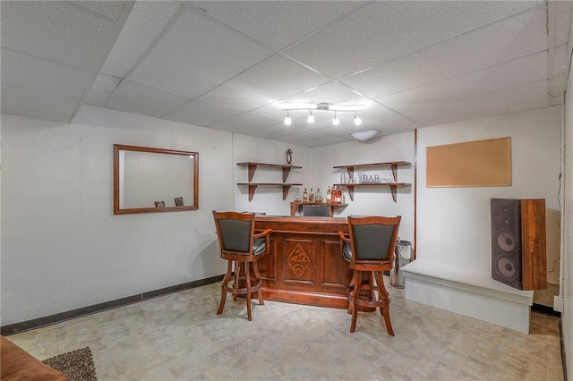 21212 E 52nd Street Ct, Blue Springs, MO 64015 - bar with light floors, a dry bar, baseboards, and a drop ceiling