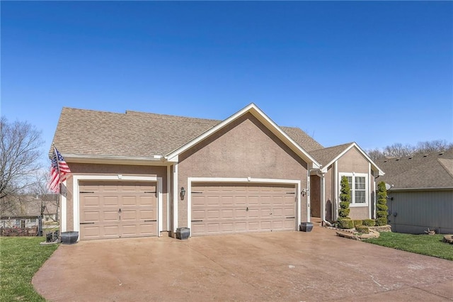 21212 E 52nd Street Ct, Blue Springs, MO 64015 - view of front facade featuring an attached garage, driveway, and stucco siding