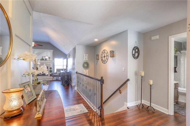 21212 E 52nd Street Ct, Blue Springs, MO 64015 - hall featuring wood finished floors, an upstairs landing, baseboards, lofted ceiling, and recessed lighting