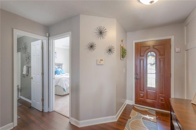 21212 E 52nd Street Ct, Blue Springs, MO 64015 - foyer entrance featuring dark wood finished floors and baseboards