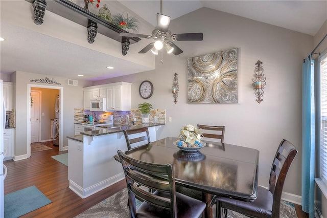 21212 E 52nd Street Ct, Blue Springs, MO 64015 - dining space with baseboards, visible vents, dark wood-type flooring, and washer / clothes dryer