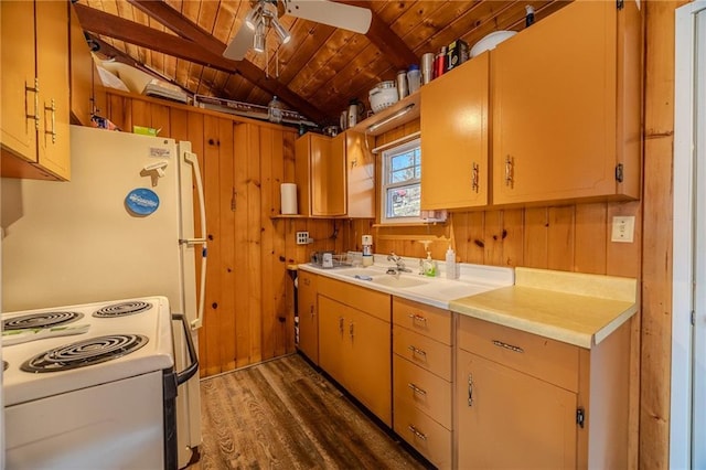 kitchen with white appliances, a sink, light countertops, wood ceiling, and wood walls