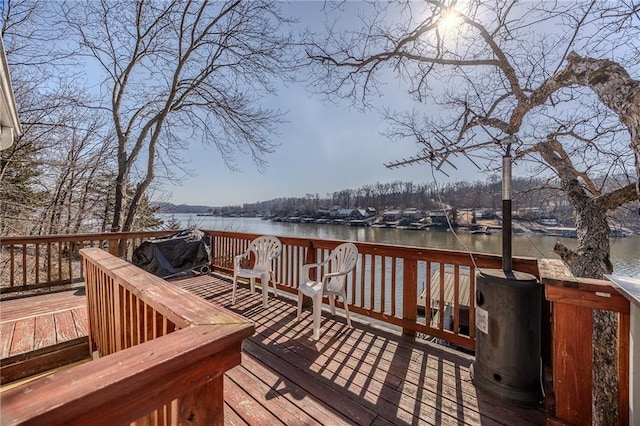 wooden terrace with a water view