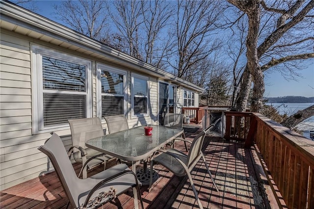 wooden terrace featuring outdoor dining area