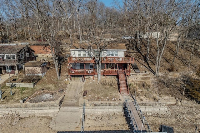 view of front facade with a deck and stairs