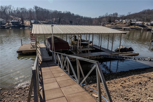 dock area featuring a water view and boat lift