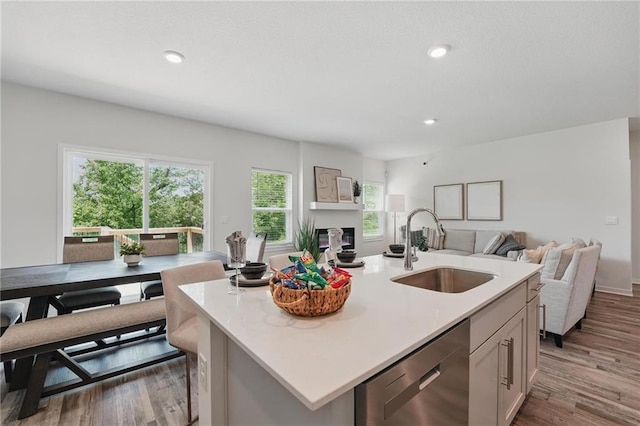 1605 Maci St, Belton, MO 64012 - kitchen with a sink, dishwasher, open floor plan, light countertops, and recessed lighting