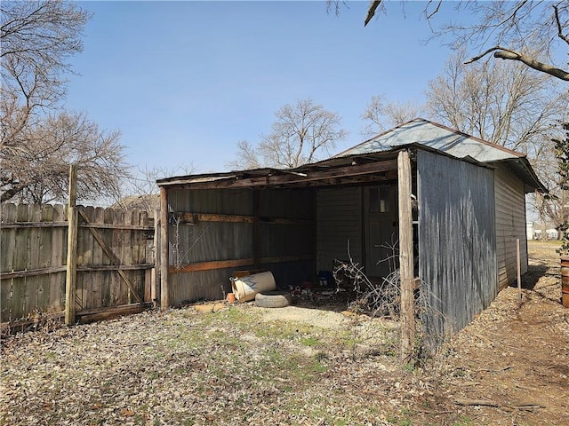 view of pole building with fence