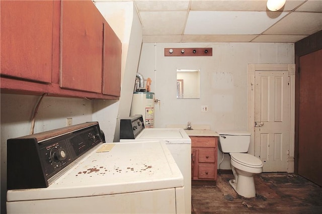 laundry area featuring laundry area, gas water heater, and separate washer and dryer