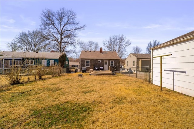 view of yard with a fenced backyard and a deck