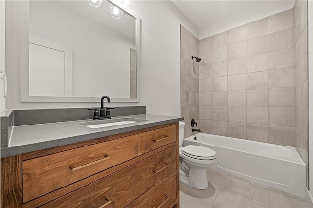 bathroom with tile patterned floors, vanity, toilet, and washtub / shower combination