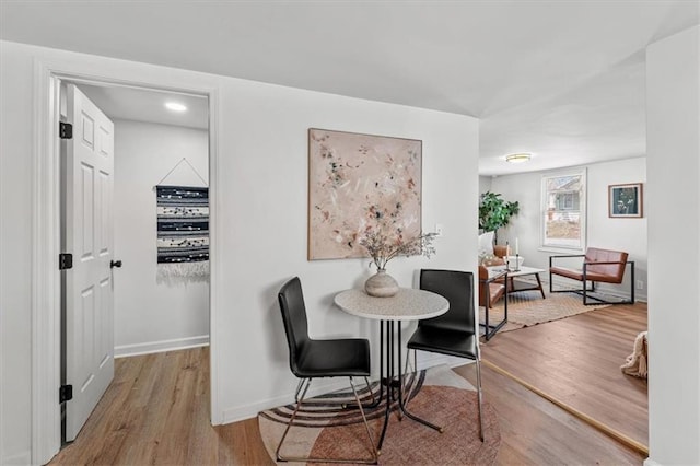 dining room with wood finished floors and baseboards