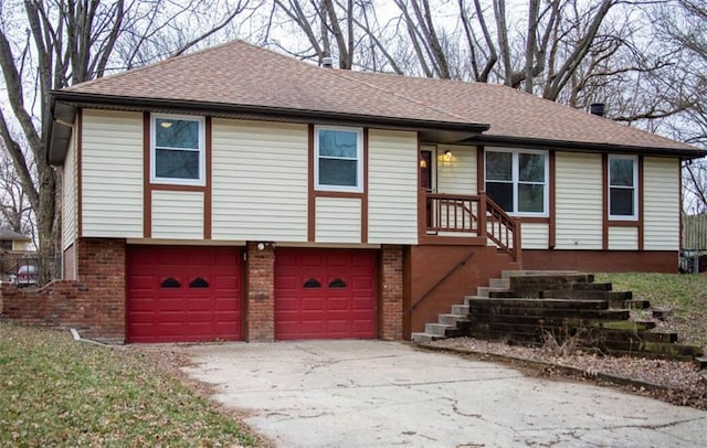 view of front of house with concrete driveway, an attached garage, brick siding, and a shingled roof