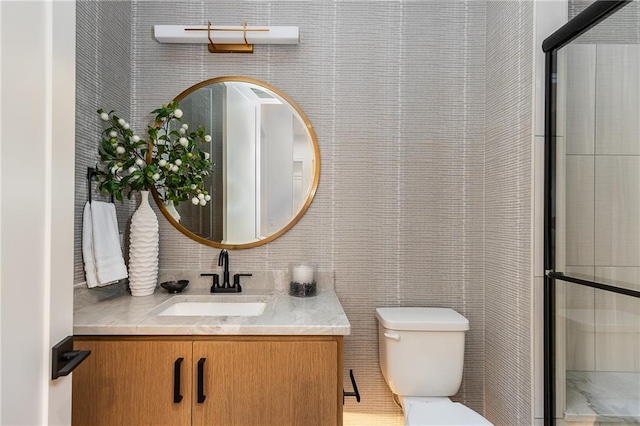 bathroom with toilet and vanity