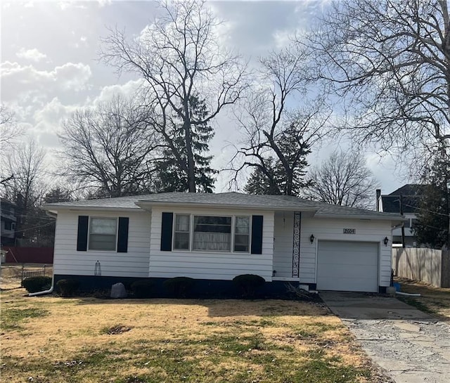 single story home featuring an attached garage, concrete driveway, a front lawn, and fence