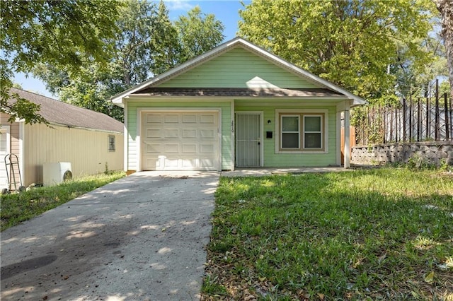 view of front of property with concrete driveway and a front lawn