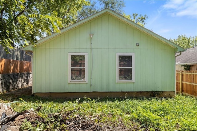 view of side of property with fence