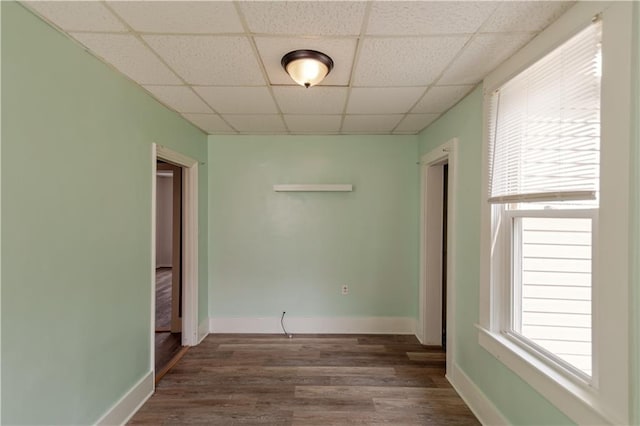 713 N 13th St, Atchison, KS 66002 - unfurnished room with a drop ceiling, wood finished floors, and healthy amount of natural light
