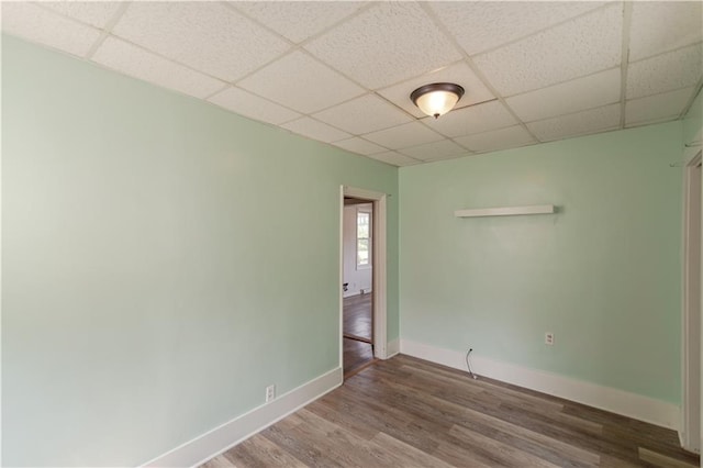 713 N 13th St, Atchison, KS 66002 - empty room with a drop ceiling and wood finished floors
