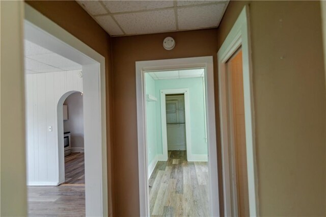 713 N 13th St, Atchison, KS 66002 - corridor with a drop ceiling, arched walkways, and wood finished floors